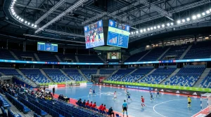 Estadio deportivo español con pantallas mostrando datos de competición en directo